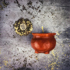 Red beeswax cauldron of magick spell candle by Parlour of Wonders for transformation and positive change magic.