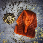 Red beeswax Egyptian King Spell Candle by Parlour of Wonders, featuring intricate hieroglyphic designs and a regal, powerful appearance.