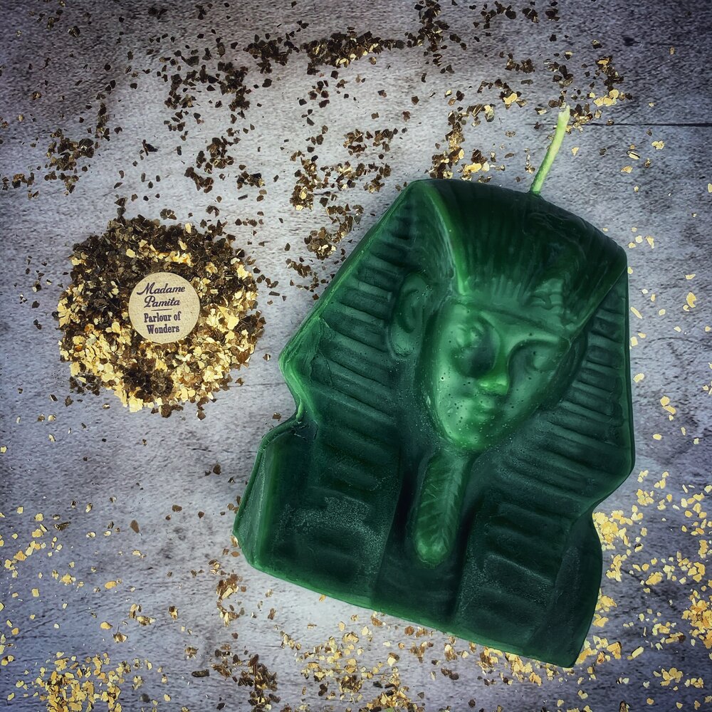 Red beeswax Egyptian King Spell Candle by Parlour of Wonders, featuring intricate designs symbolizing power, magnetism, and pharaoh magic.
