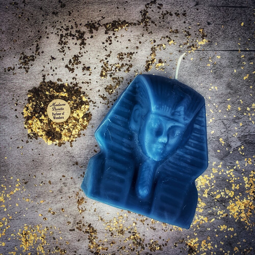 Red beeswax Egyptian King Spell Candle by Parlour of Wonders, featuring intricate hieroglyphic designs for power and magnetism.