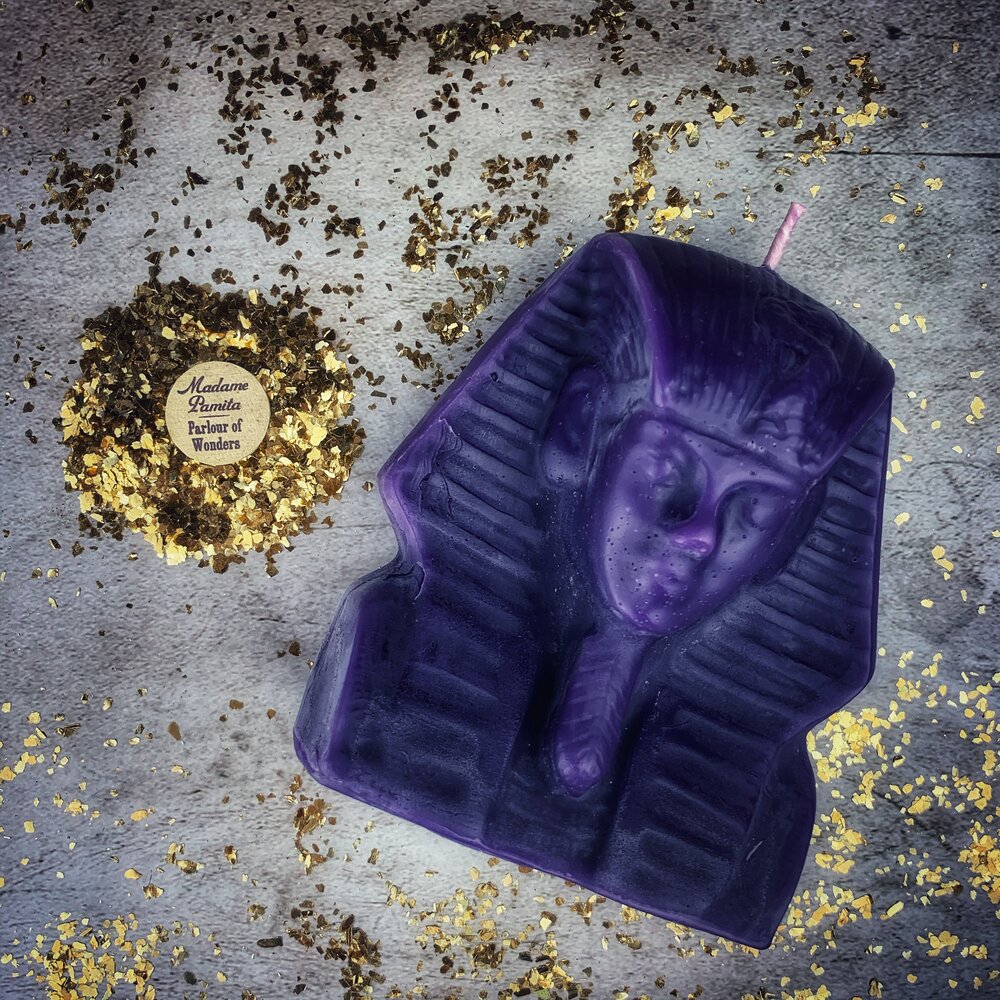 Red beeswax Egyptian King Spell Candle by Parlour of Wonders, featuring intricate hieroglyphic designs for power and magnetism magic.