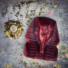 Red beeswax Egyptian King Spell Candle by Parlour of Wonders, featuring intricate hieroglyphic designs for power and magnetism magic.