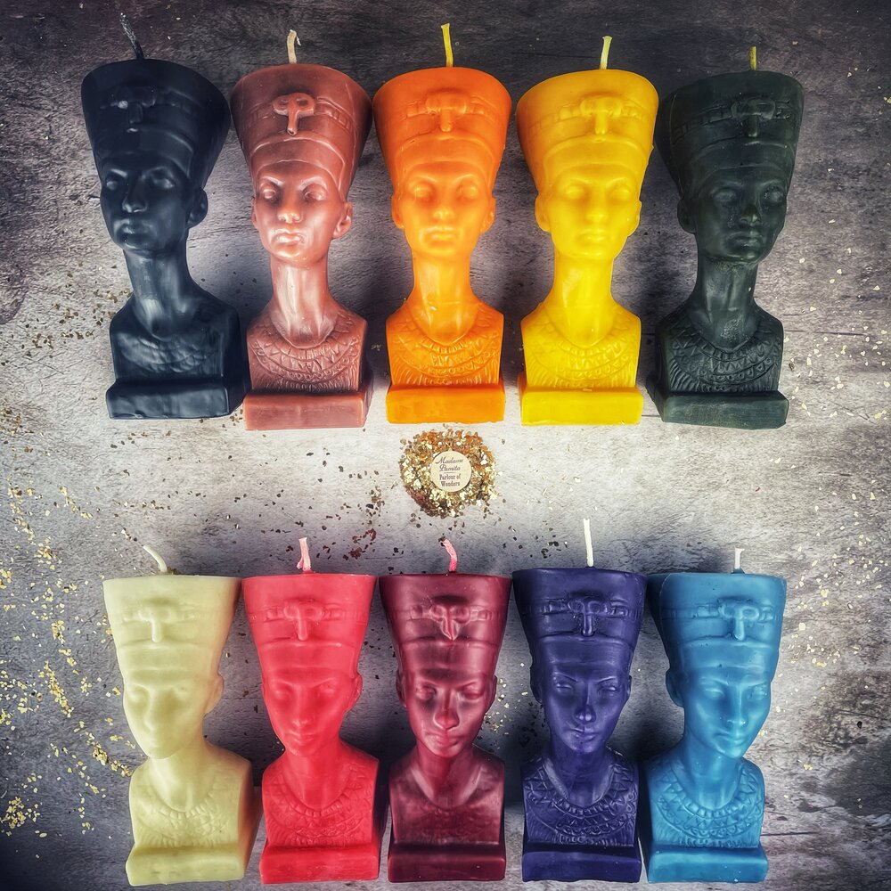 Red beeswax Egyptian Queen spell candle by Parlour of Wonders, featuring intricate hieroglyphs and a regal design for magic and power.