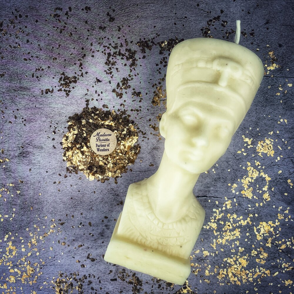 Red beeswax Egyptian Queen spell candle by Parlour of Wonders, featuring intricate designs symbolizing power, beauty, and magnetism.