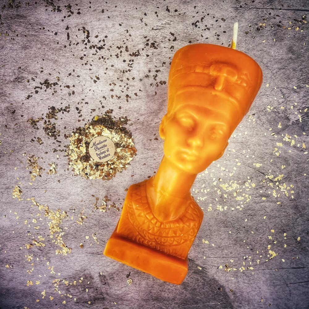 Red beeswax Egyptian Queen spell candle by Parlour of Wonders with ornate design, symbolizing power, beauty, and magnetism magic.