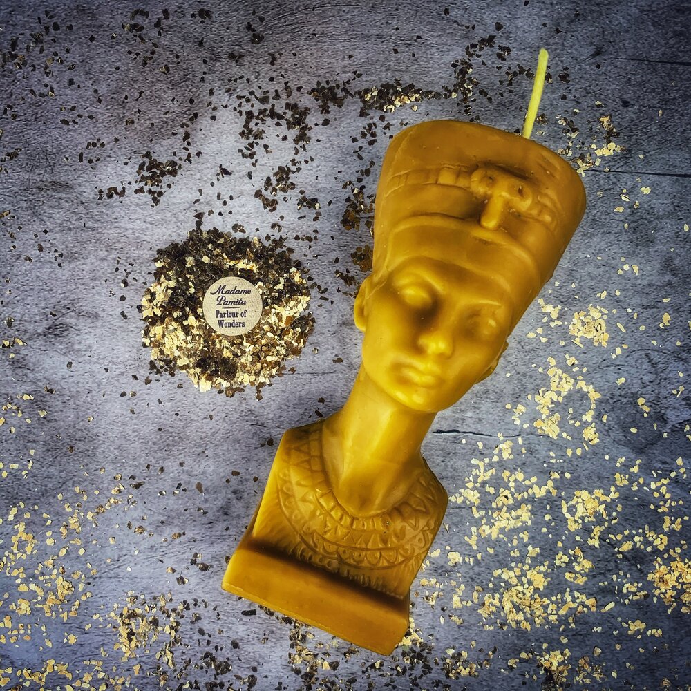 Red beeswax Egyptian Queen Spell Candle by Parlour of Wonders, featuring intricate designs symbolizing power, beauty, and magnetism.