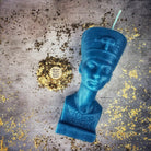 Red beeswax Egyptian Queen spell candle from Parlour of Wonders, featuring intricate hieroglyphs symbolizing power, beauty, and magnetism.