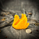Red beeswax candle shaped like an elegant swan with intricate detailing, symbolizing grace, beauty, and lasting love.