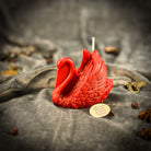 Red beeswax Swan spell candle by Parlour of Wonders, featuring an elegant swan shape symbolizing grace, beauty, and lasting love.