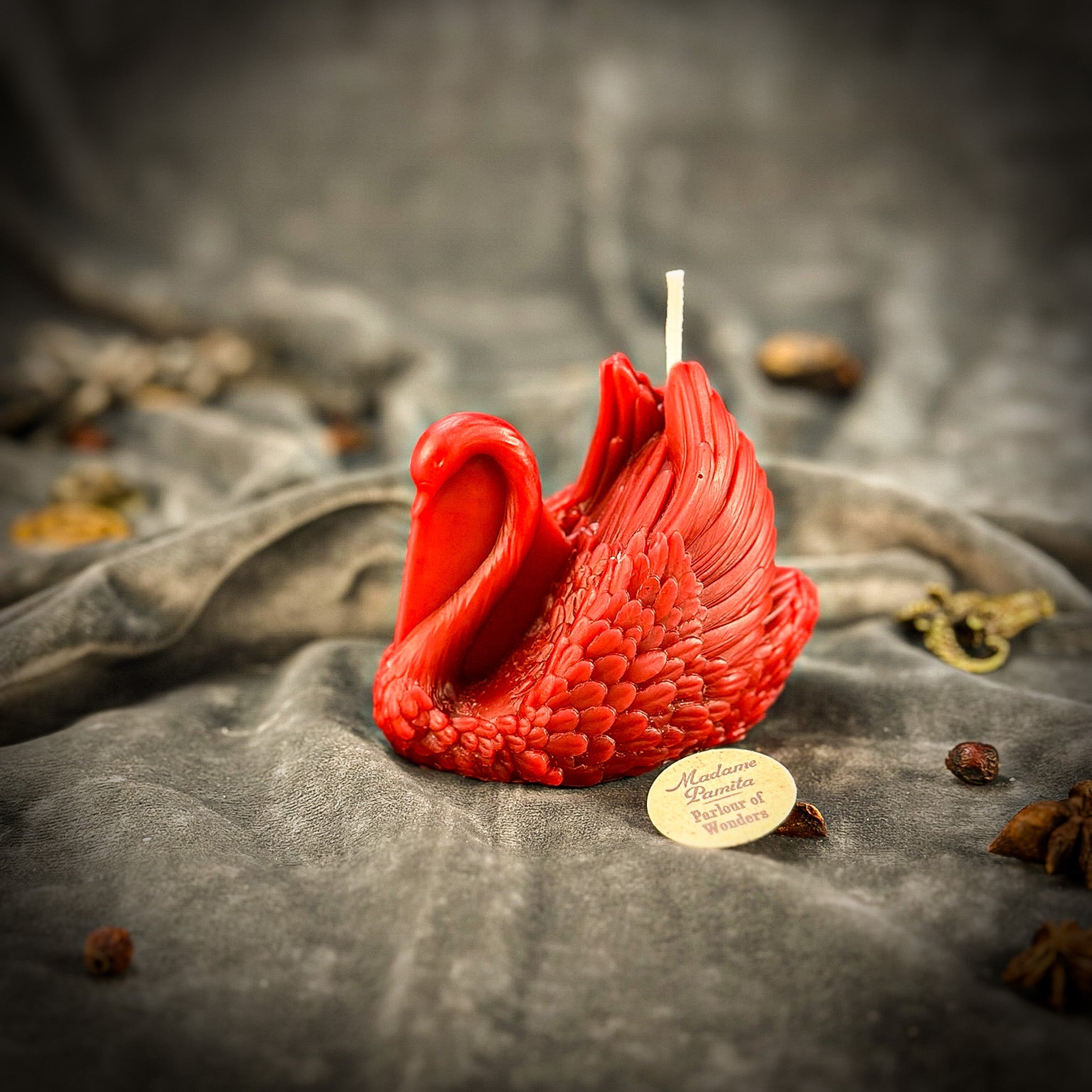 Red beeswax Swan spell candle by Parlour of Wonders, featuring an elegant swan shape symbolizing grace, beauty, and lasting love.