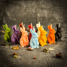 Red beeswax Enchanted Bunny Spell Candle by Parlour of Wonders, promoting abundance, fertility, and quick thinking.