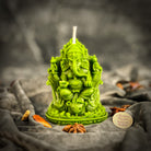 Red beeswax Ganesha spell candle from Parlour of Wonders with intricate Ganesha design for obstacle removal and success magic.