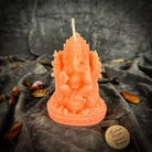Red beeswax Ganesha spell candle from Parlour of Wonders, featuring intricate Ganesha design for obstacle removal and success magic.