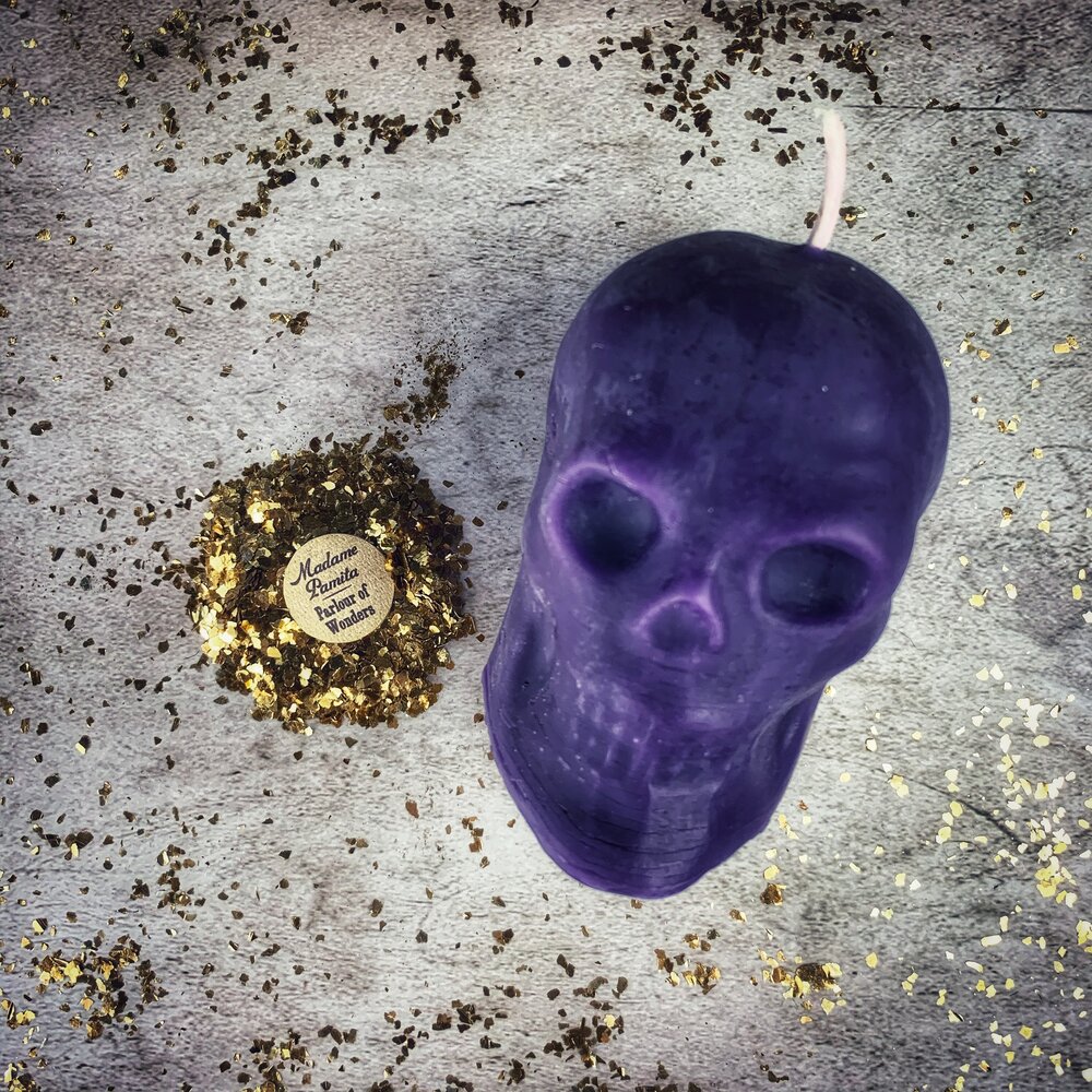 Large red beeswax skull spell candle by Parlour of Wonders, featuring detailed skull design for mind influence and ancestral magic.