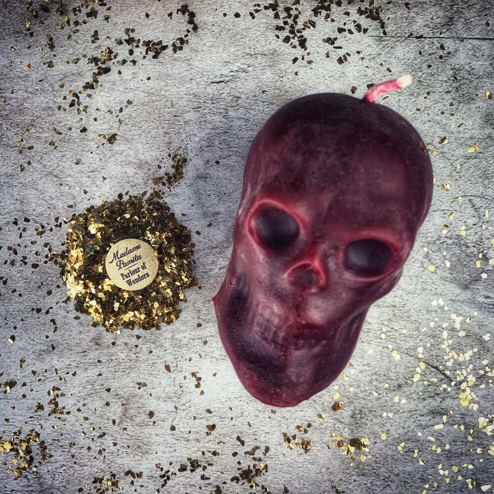 Large red beeswax skull candle from Parlour of Wonders with intricate details, ideal for mind influence and ancestral wisdom magic.