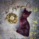 Red beeswax lucky cat spell candle by Parlour of Wonders for fast action and manifestation magic.