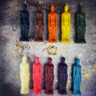 Red beeswax male figural spell candle from Parlour of Wonders, used for sympathetic magic and personal power rituals.