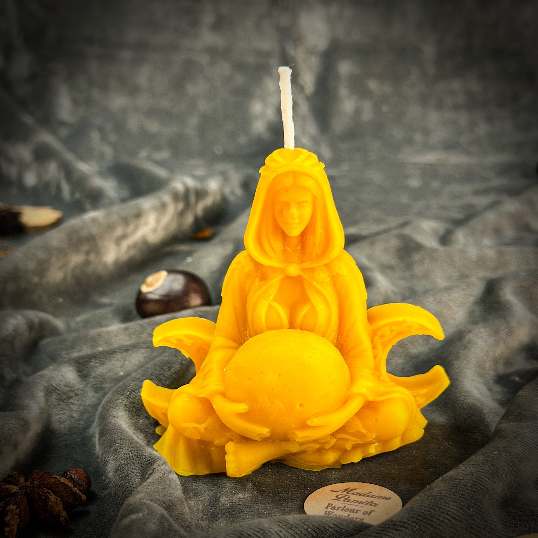 Red beeswax Moon Goddess spell candle with lunar symbols, representing divine feminine energy and lunar magic.