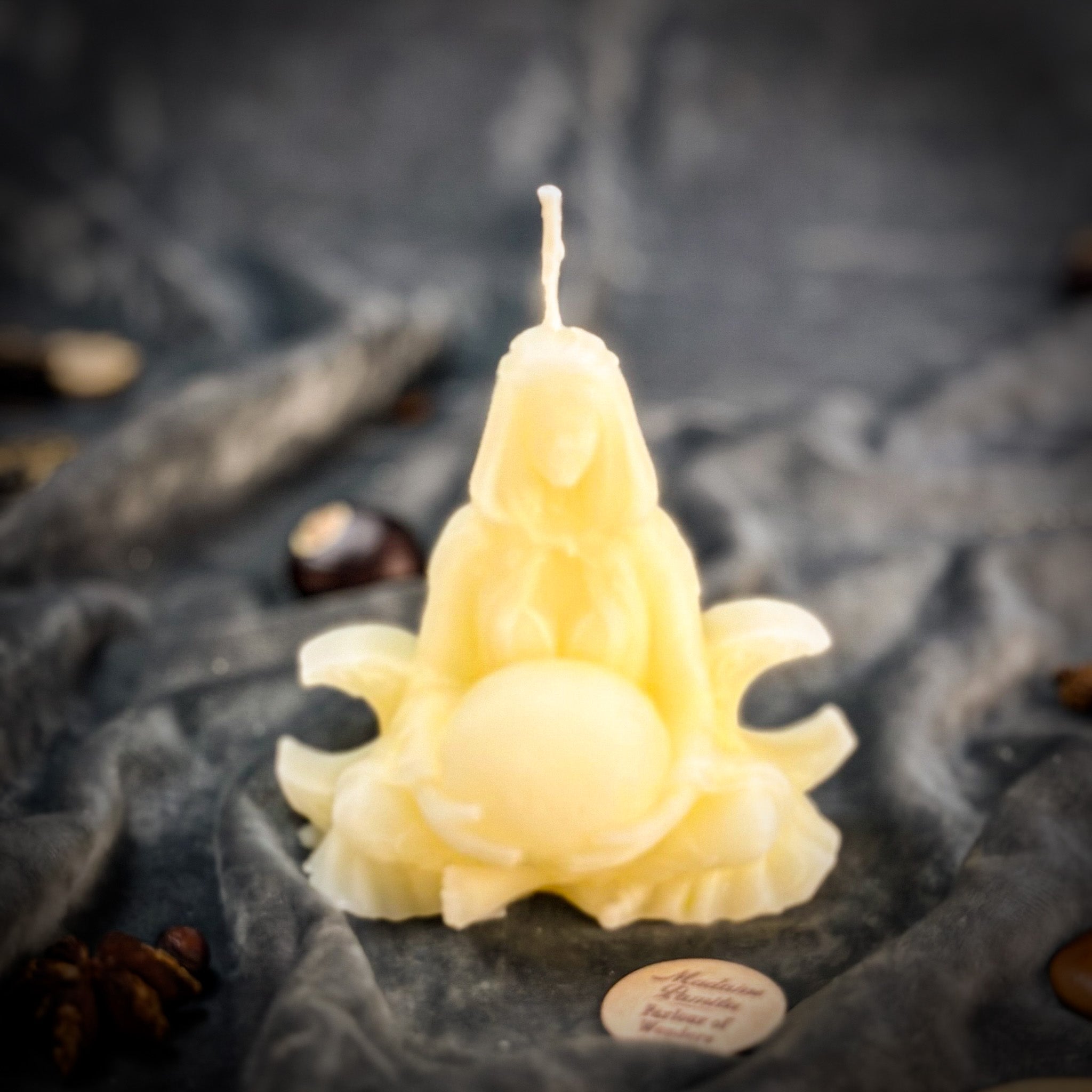 Red beeswax Moon Goddess spell candle with moon and goddess symbols, promoting lunar magic and divine feminine energy.