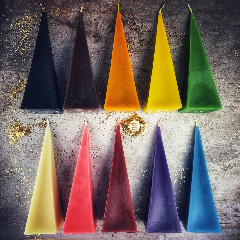 Red beeswax pyramid candle by Parlour of Wonders, designed for success and stability magic with a long-lasting burn.