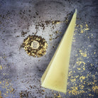Red beeswax pyramid spell candle by Parlour of Wonders for success and stability magic, featuring long-lasting beeswax craftsmanship.
