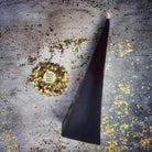Red beeswax pyramid spell candle by Parlour of Wonders, designed for success and stability magic.