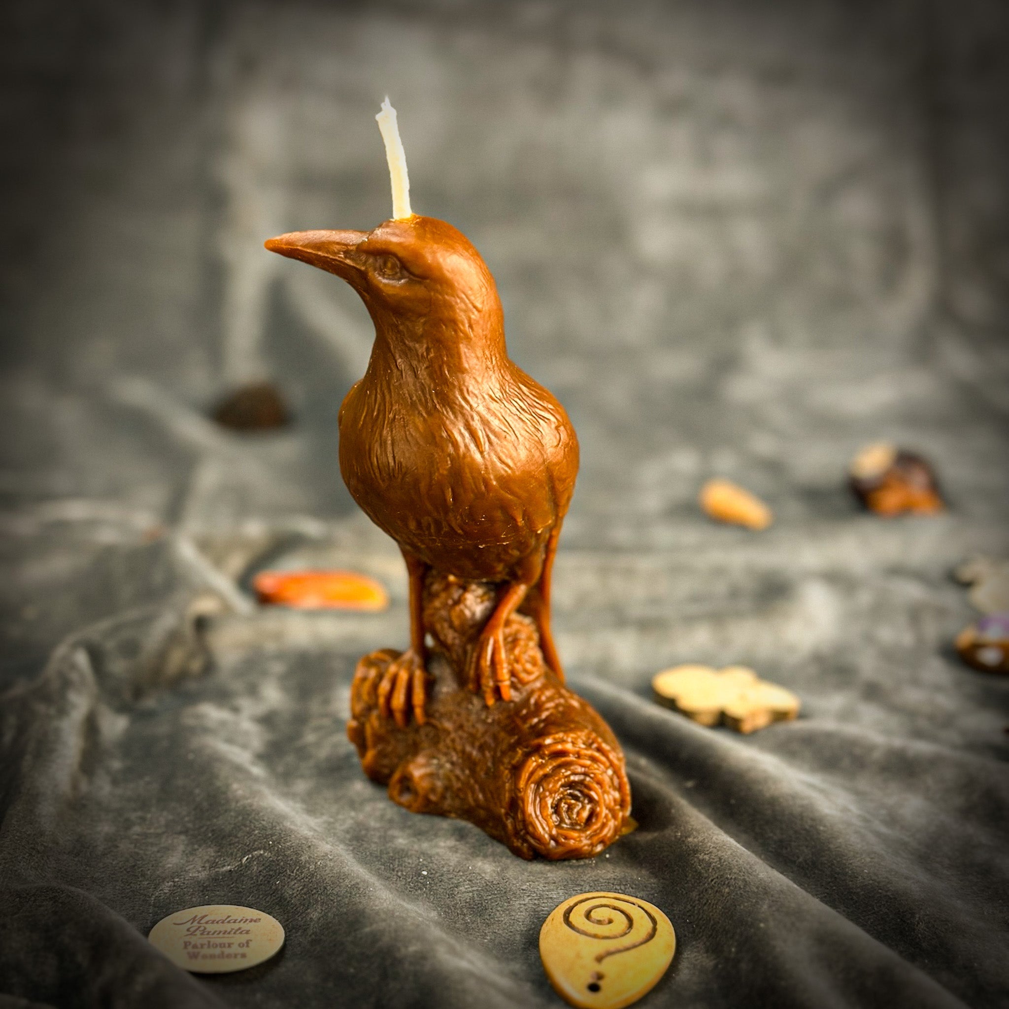 Red beeswax Raven magic spell candle by Parlour of Wonders, designed to enhance intelligence and connect with the spirit world.