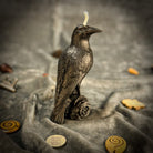 Red beeswax Raven Magic Spell Candle by Parlour of Wonders, symbolizing intelligence and spirit world connection.