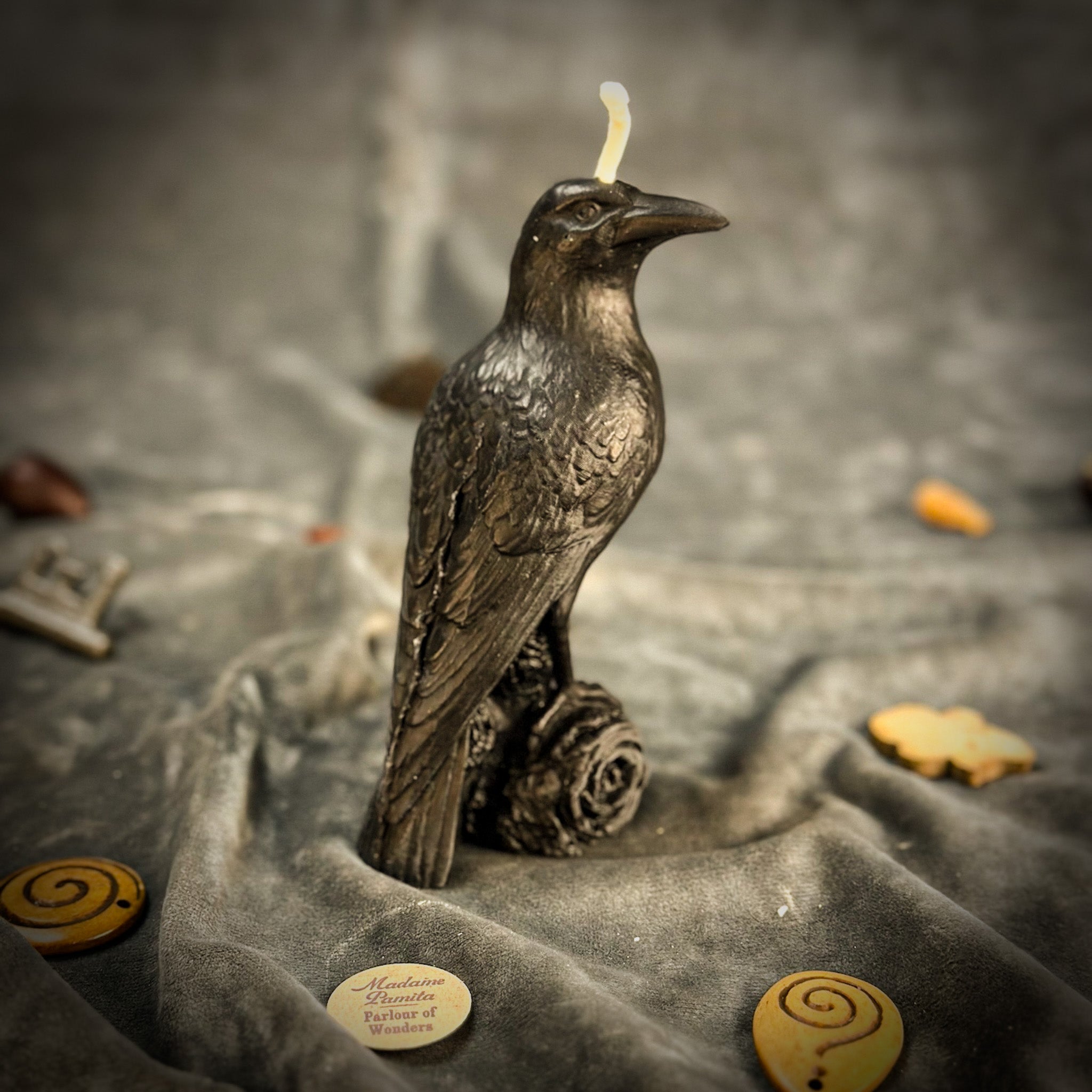 Red beeswax Raven Magic Spell Candle by Parlour of Wonders, symbolizing intelligence and spirit world connection.