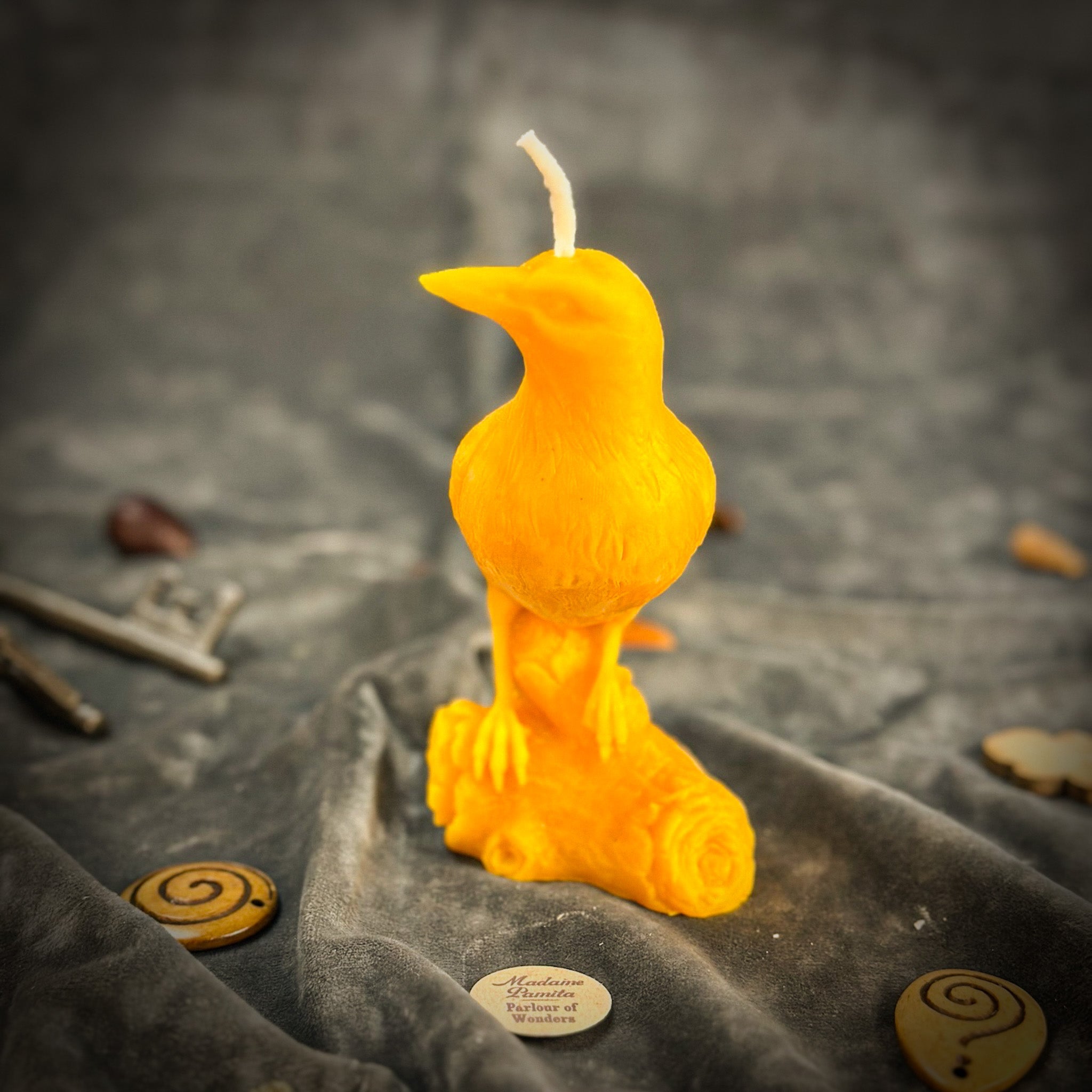 Red beeswax Raven Magic Spell Candle by Parlour of Wonders, designed to enhance intelligence and connect with the spirit world.