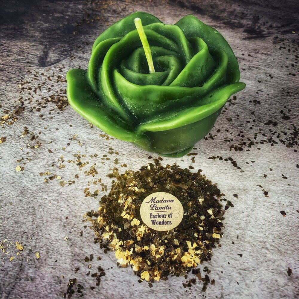 Red beeswax romance spell candle by Parlour of Wonders featuring a rose design, used for true love and soul mate magic.