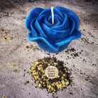 Red beeswax candle with rose design from Parlour of Wonders, used for love and soulmate magic rituals.