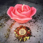 Red beeswax candle with rose design from Parlour of Wonders, used for love and soul mate magic spells.