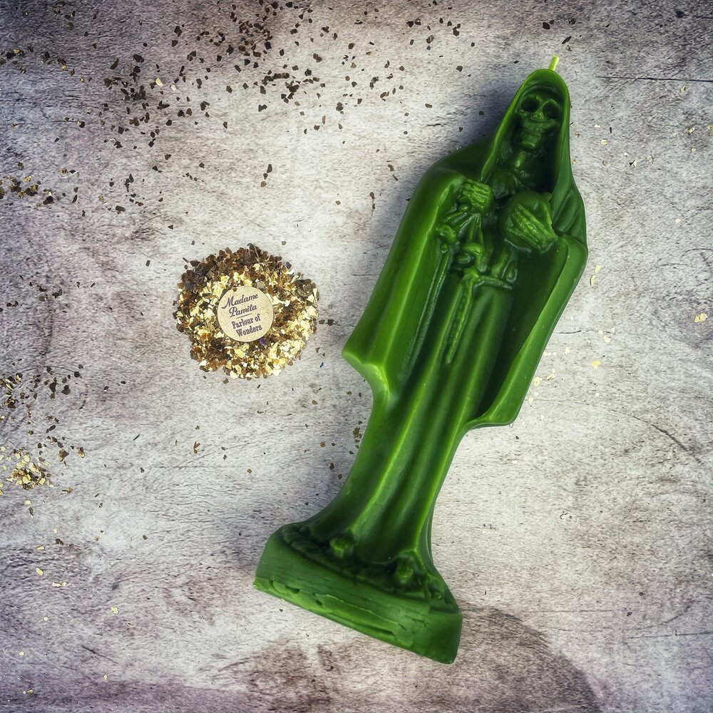 Red beeswax Santa Muerte spell candle by Parlour of Wonders, featuring sacred folk saint imagery for devotion and protection magic.