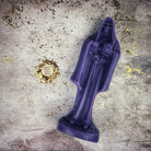 Red beeswax Santa Muerte spell candle with sacred folk saint design for devotion and protection magic, by Parlour of Wonders.