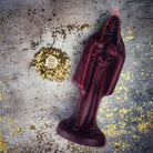 Red beeswax Santa Muerte spell candle from Parlour of Wonders for devotion and protection magic, featuring sacred folk saint imagery.
