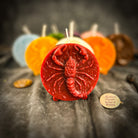 Red beeswax Scorpio zodiac spell candle with scorpion design, symbolizing transformation, power, and intuition.