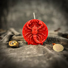 Red beeswax Scorpio zodiac candle featuring a scorpion design, symbolizing transformation, power, and intuition.