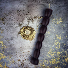 Red beeswax seven-knob spell candle from Parlour of Wonders for seven-day manifestation magic, featuring intricate wax details.