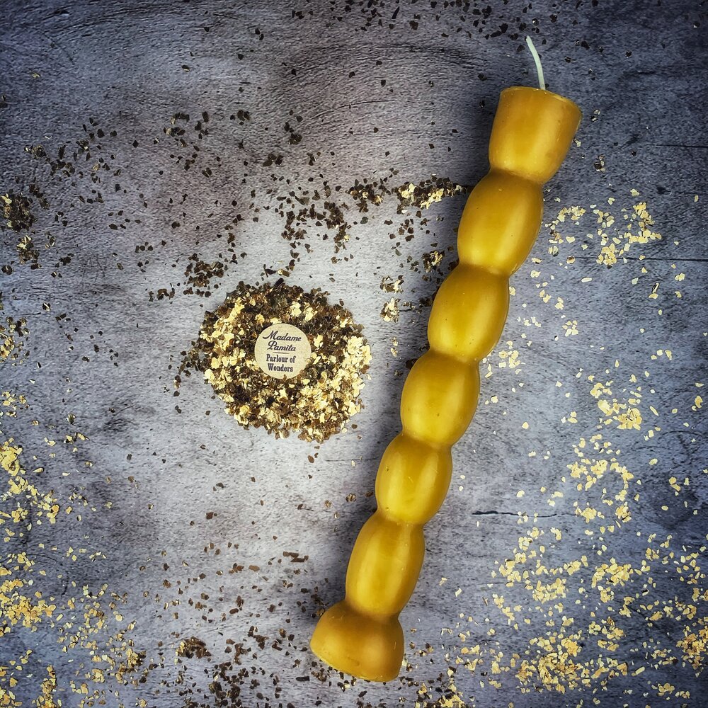 Red beeswax Seven Knob Spell Candle by Parlour of Wonders for seven-day manifestation and magic rituals.