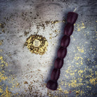 Red beeswax seven-knob spell candle by Parlour of Wonders, designed for seven-day manifestation magic.