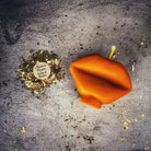 Red beeswax candle shaped like lips, used for communication and passion magic, by Parlour of Wonders.