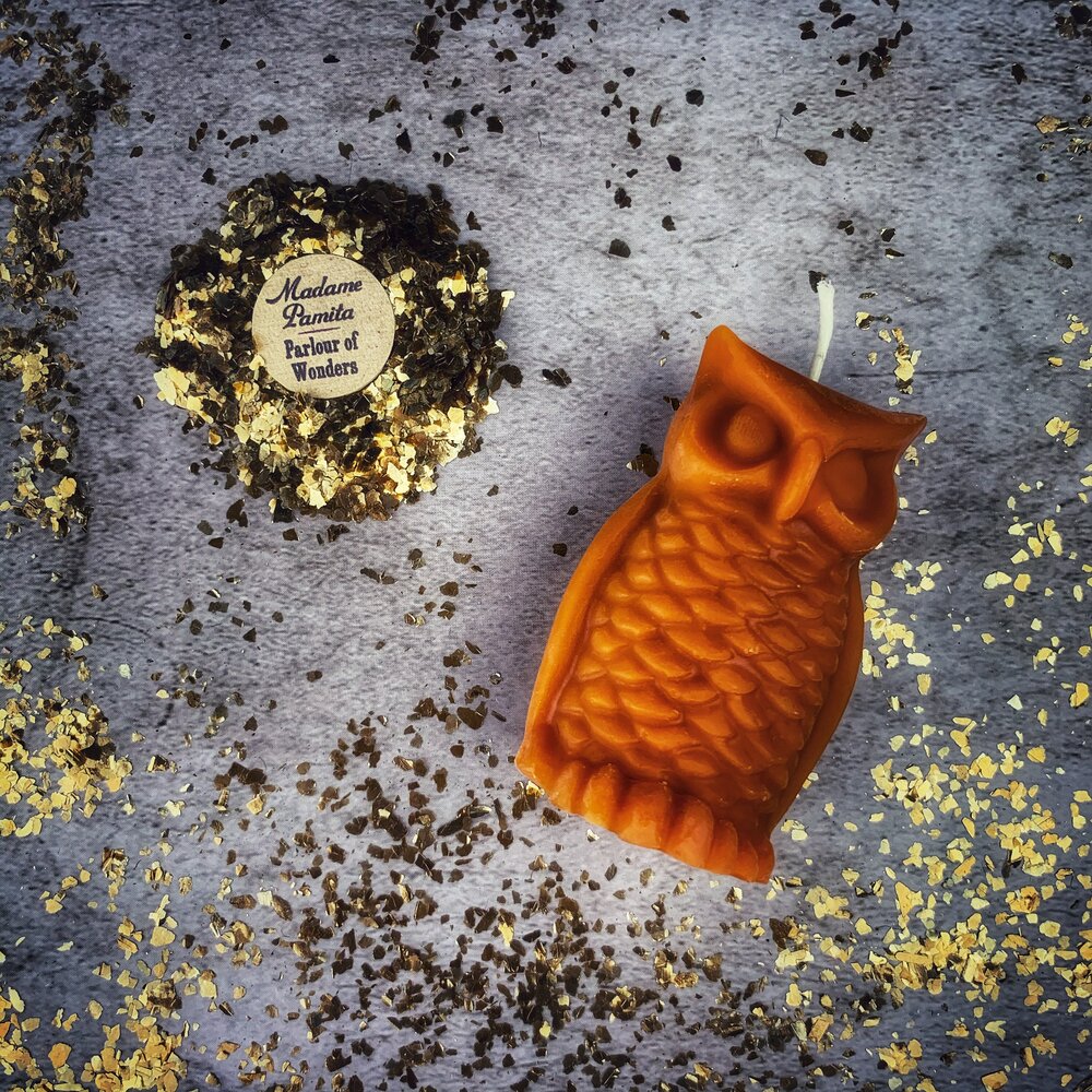 Red beeswax Wise Owl spell candle by Parlour of Wonders, featuring detailed owl design for wisdom and psychic awareness magic.