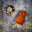 Red beeswax Wise Owl spell candle by Parlour of Wonders, featuring detailed owl design for wisdom and psychic awareness magic.