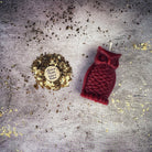 Red beeswax Wise Owl spell candle from Parlour of Wonders, symbolizing wisdom and psychic awareness in a detailed wax design.