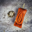 Red beeswax Yoni vulva spell candle from Parlour of Wonders, designed for passionate love and sex magic rituals.