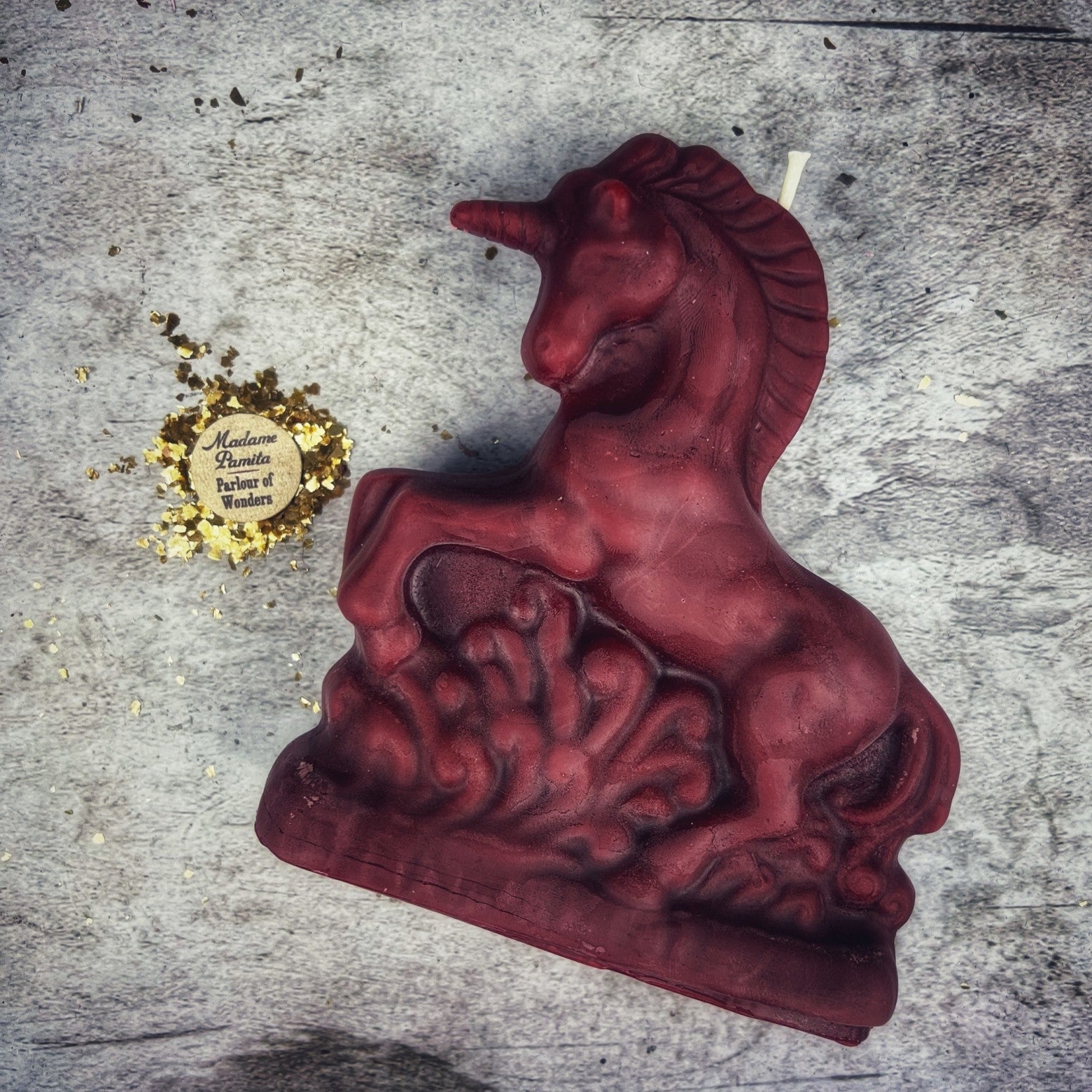 White beeswax unicorn spell candle by Parlour of Wonders, featuring enchanted design for manifestation and wishes magic.