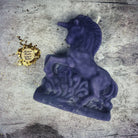 White beeswax unicorn spell candle by Parlour of Wonders for manifestation, wishes, and magic, featuring intricate enchanted unicorn design.