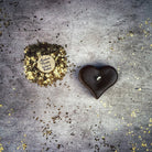 White beeswax mini heart candle by Parlour of Wonders, used for love influence and emotional healing magic.