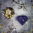 White beeswax mini heart candle from Parlour of Wonders, used for love influence and emotional healing magic.